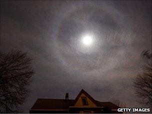 Lunar halo - ring of light - above a house