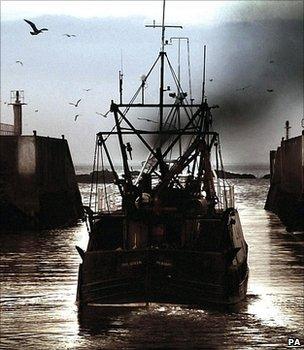 Fishing boat leaving a harbour (Image: PA)