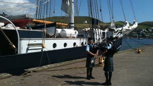 Pipers beside Tall Ship