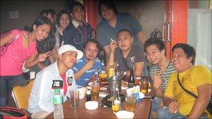 Jaycee Solis with his friends in the bar after work - at 7am