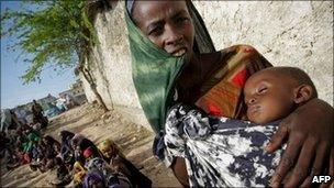 A Somali woman holds her severely malnourished baby outside a tent serving as a medical clinic established by the African Union Mission in Somalia (Amisom) peacekeeping operation in the capital, Mogadishu