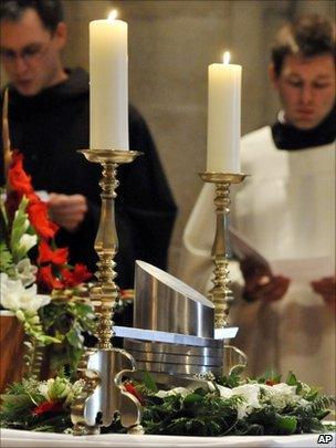 Hungarian monks pray in front of the heart urn of Otto von Habsburg during the requiem at the Benedictine Abbey of Pannonhalma in Hungary