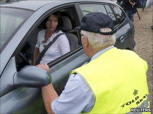 Danish customs officer checks car on Danish-German border, 5 July 11