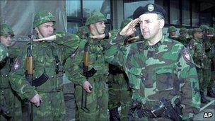 Zeljko Raznatovic known as Arkan, reviews his unit, the Serb Volunteer Guard, called the Tigers, in western Bosnia in 1995