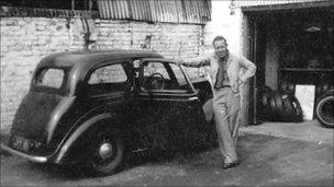 Geoffrey Williams standing next to his car