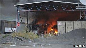 The Serbia-Kosovo border crossing in Jarinje burns after masked Serbs set it on fire on 27 July