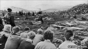 A rescue helicopter and stretchers at the site of the Viking airliner disaster near Stavanger, Norway