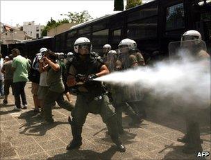 Greek riot police clash with taxi drivers in Athens, July 2011