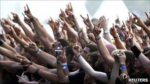The crowd raises their arms during a performance at an annual heavy metal music open-air festival in the northern German village of Wacken (generic image from 4 August 2011)