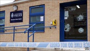 Smashed glass at Meadows police station, Nottingham