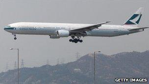 A Cathay Pacific plane prepares to land in Hong Kong