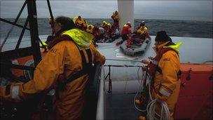 Twenty-one crew members were rescued by the RNLI after the yacht Rambler 100 overturned during the Fastnet race