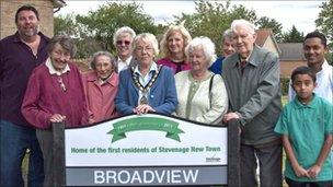 Local residents at the commemorative Broadview sign with mayor Carol Latif (centre) and council leader, Sharon Taylor (back row, right from centre).