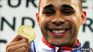 Gold medallist Jason Gardener of Great Britain stands on the podium during the medal presentation for the Men's 60 metres