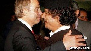 Prime Minister Tony Blair embraces Colonel Muammar Gaddafi after a meeting on May 29, 2007 in Sirte, Libya