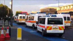 Riot vans around bus