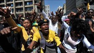A crowd protests in Johannesburg on Monday after a court bans an anti-apartheid song
