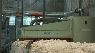 Bales of cotton being processed