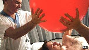 Patient doing exercises with a Swiss ball
