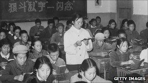 A 1960s photo released by the Chinese official news agency of high school students, reading Mao's Little Red Book