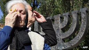 Ukrainian members of the Jewish community wipe their tears during a memorial ceremony at the Minora monument in Babi Yar in September 2007