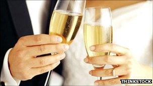 Generic image of newlyweds with champagne