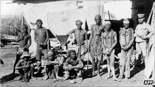 A soldier supervises chained prisoners during Germany's 1904-1908 war on the Herero and Nama