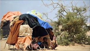 Young Somalis shelter inside a makeshift tent at a camp site in Doolow, south western Somalia - 2011