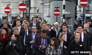 Commuters leave Waterloo Station, London