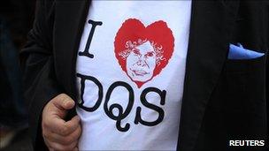 A man wears a souvenir t-shirt reading "I love DuQueSa" (duchess) outside the Palacio de las Duenas as he waits for guests to arrive before the wedding of Spain's Duchess of Alba, Cayetana Fitz-James Stuart y Silva, with Alfonso Diez in Seville on Wednesday