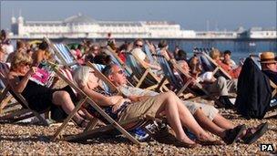 People enjoying last month's sunshine on the beach in Brighton