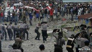 Police and protesters clash in Timika, Papua province, on 10 October 2011