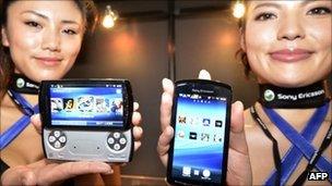 Models show off Sony Ericsson's Xperia Play handset at the Tokyo Game Show
