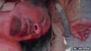 A video grab from al-Jazeera TV apparently showing Colonel Muammar Gaddafi's corpse