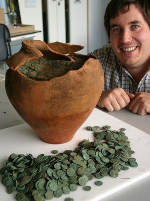 Peter Reavill with the hoard of Roman coins
