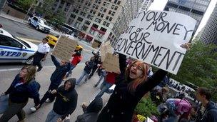 Occupy Wall Street protester holding a sign