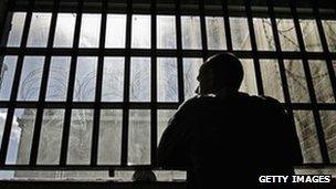 Prisoner at cell window