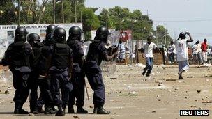 Opposition supporters confront riot police in Monrovia
