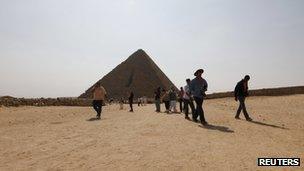 Tourists visiting the Pyramids of Giza last month