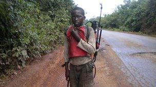 Child labourer with pesticide equipment