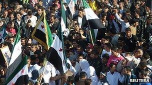 Demonstrators protest against Syria's President Bashar al-Assad in Hula, near Homs. 13 Nov 2011