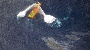 A supply boat working around the oil spill off the coast of Brazil