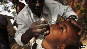 A child being given a polio vaccination in Kano in northern Nigeria in 2005