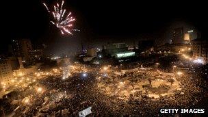 Protesters in Tahrir Square, Cairo, celebrate as Egyptian President Hosni Mubarak steps down, 11 February 2011