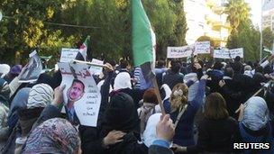 Demonstrators protest against Syria"s President Bashar al-Assad in Homs, 25 November 2011