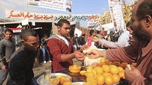 A man sells orange juice in Tahrir square in Cairo (27 November 2011)
