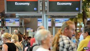 Passengers at Qantas check-in counters