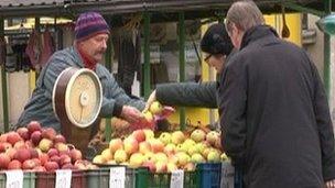 Latvians at market getting on with everyday life in the face of tough austerity