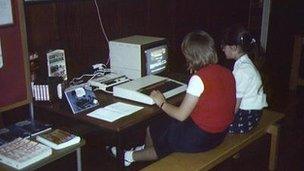 A teacher and student contribute to the Domesday Project on a BBC Micro