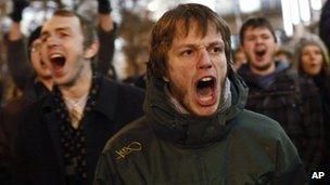 Opposition protesters shout slogans in Moscow, 6 December